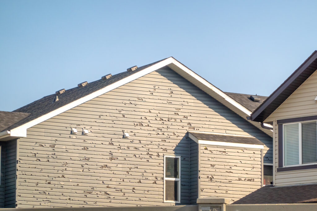 A home with severely damaged siding