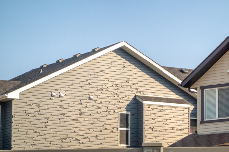 A home with severely damaged siding
